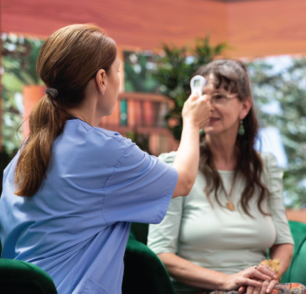 Caregiver helping a client with daily routines