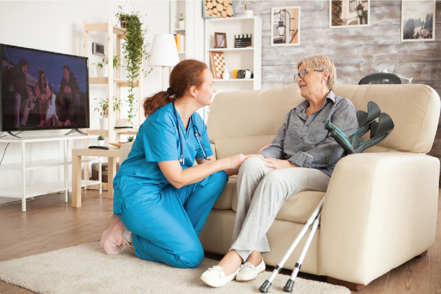 Caregiver helping tidy and organize a client's home